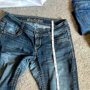 Jeans Different Sizes and Styles!!! An assortment of different pairs of jeans.